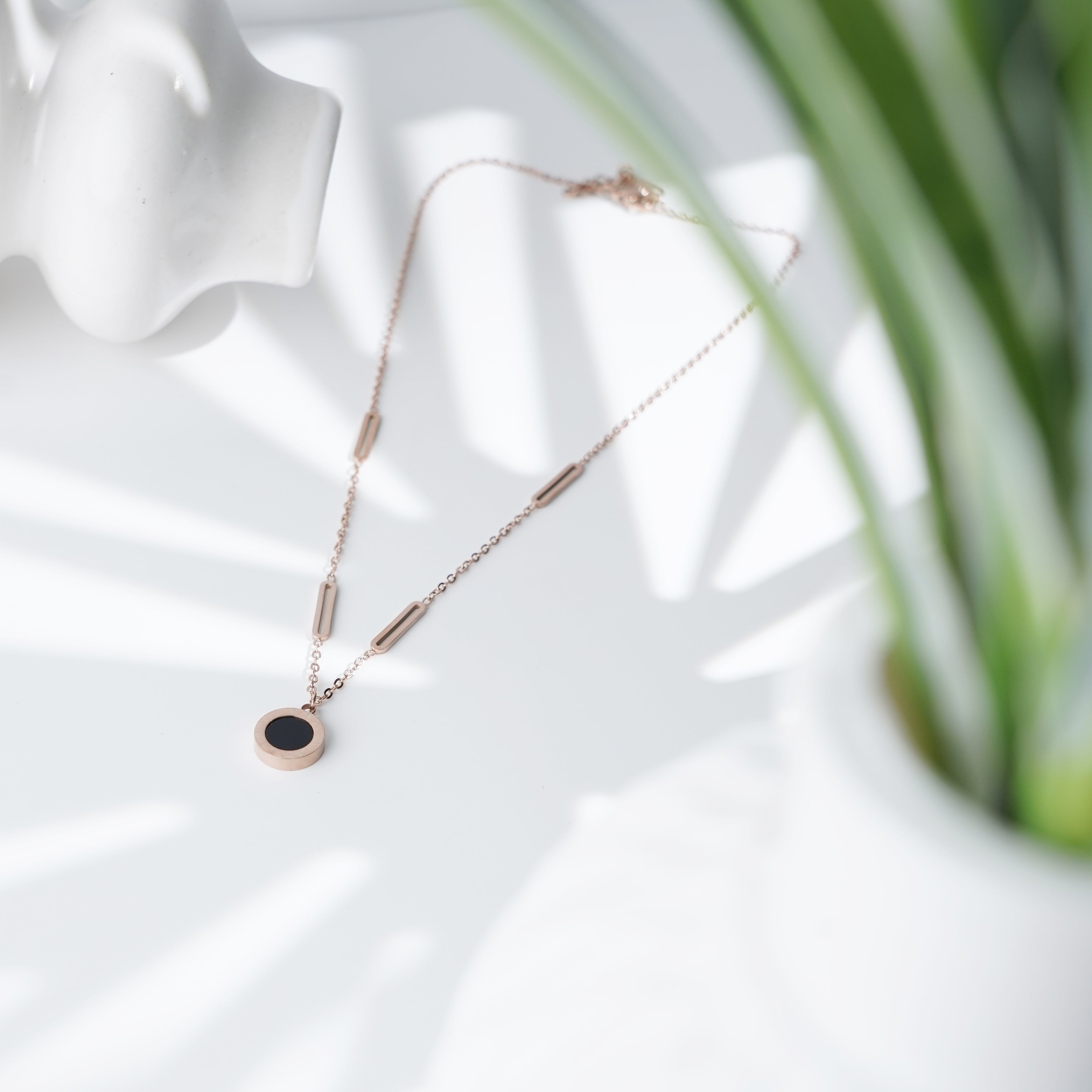Minimalist Black Disc Pendant Necklace with Rose Gold Accents