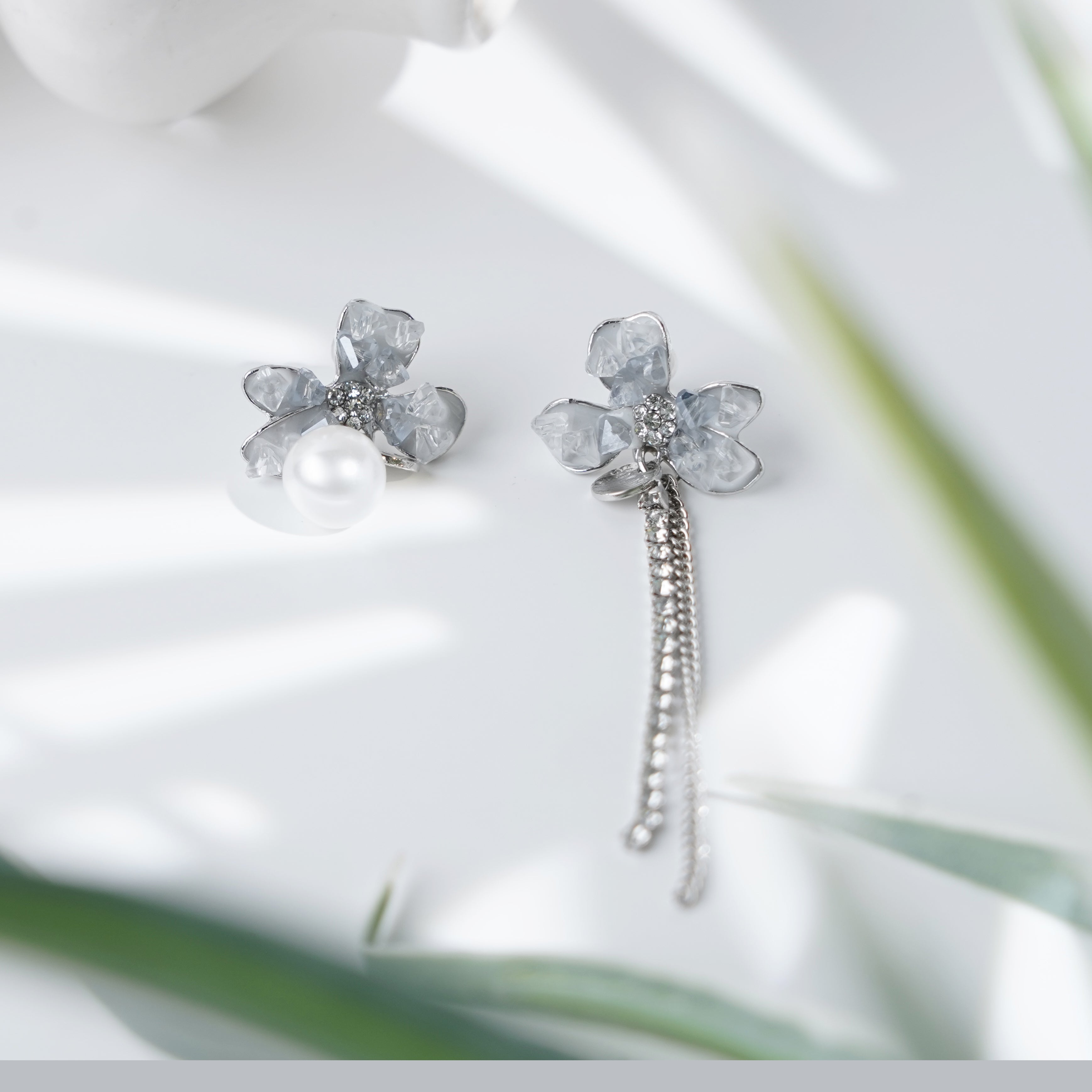 Crystal Petal Earrings with Asymmetric Pearl and Chain Design