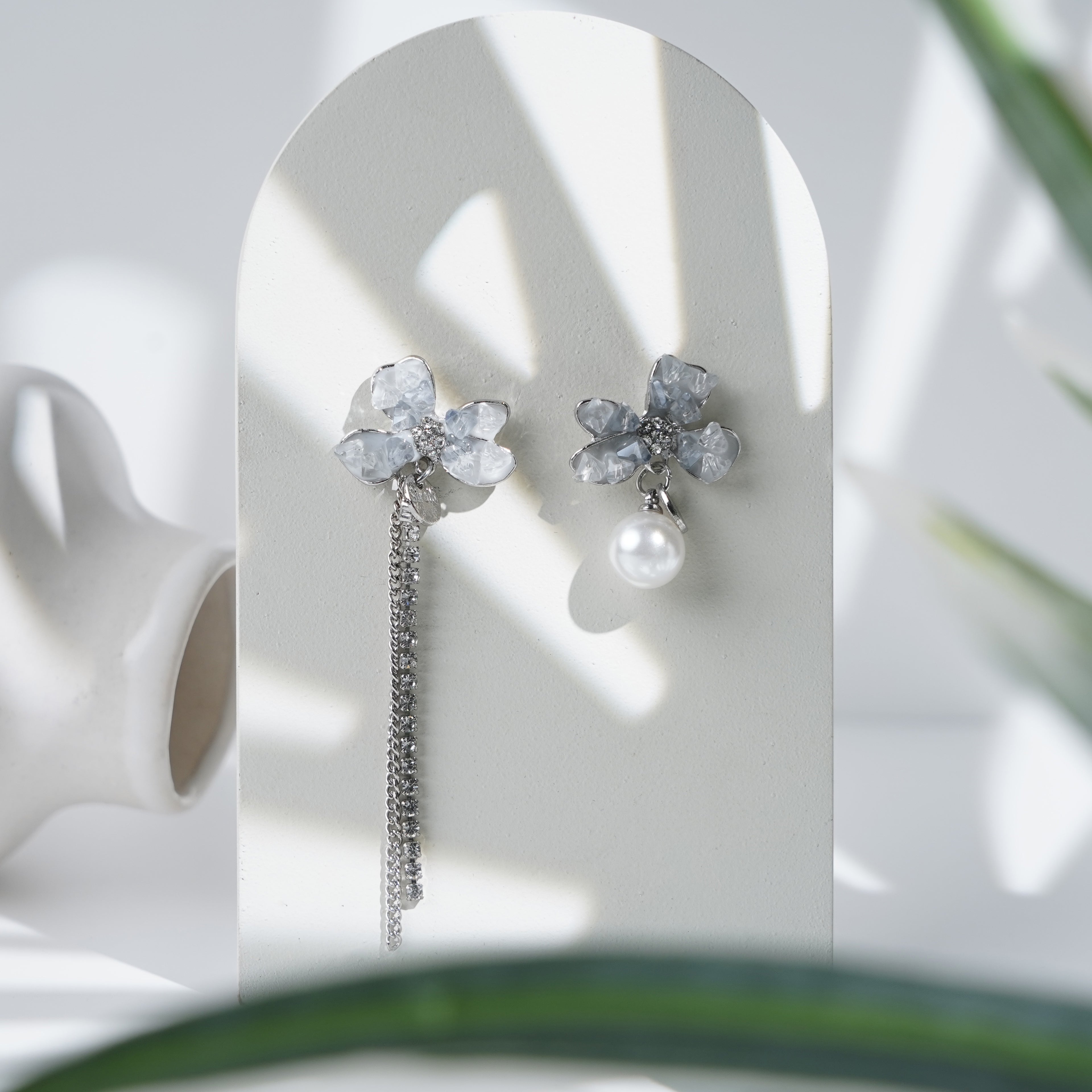Crystal Petal Earrings with Asymmetric Pearl and Chain Design