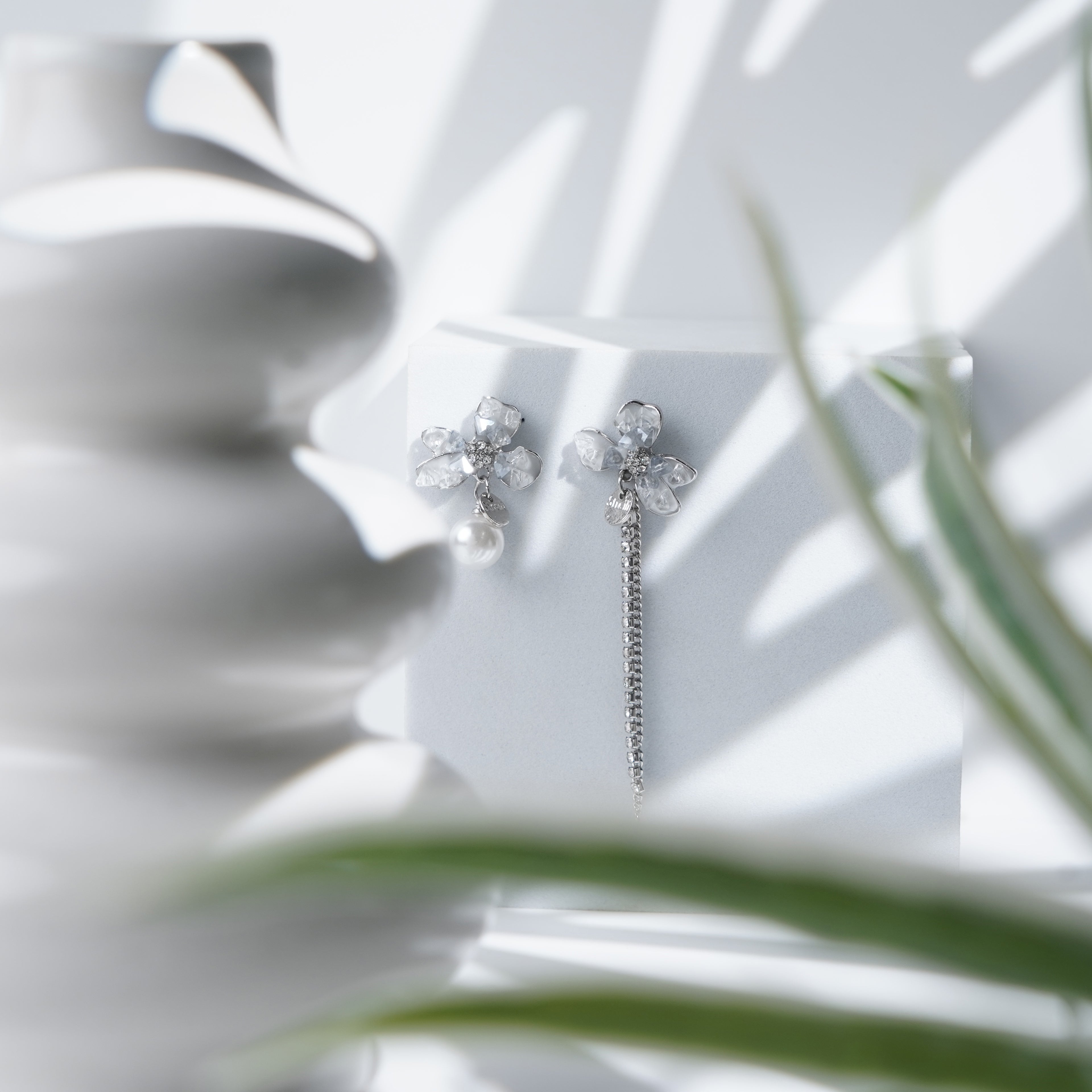 Crystal Petal Earrings with Asymmetric Pearl and Chain Design